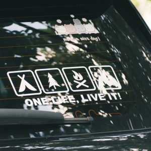 Car window decal with camping and adventure icons.